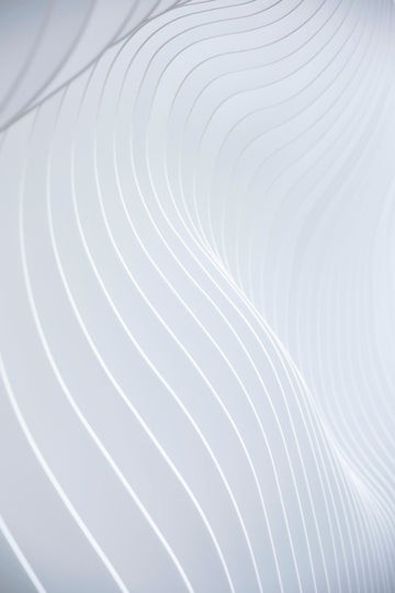 a close up of a white wall with wavy lines