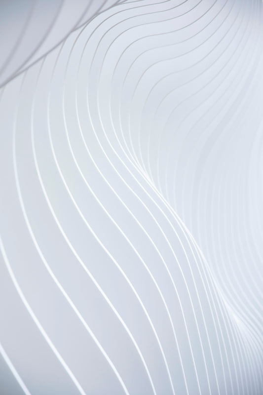 a close up of a white wall with wavy lines