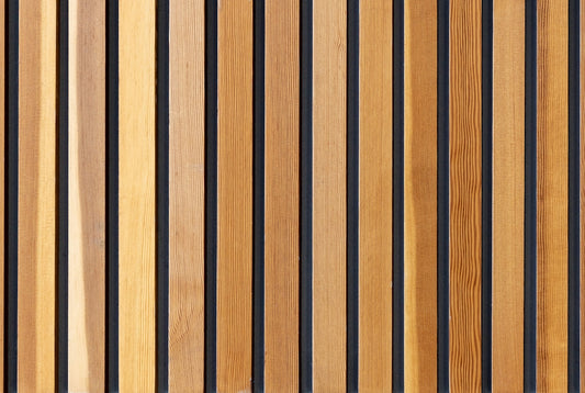 two brown wooden wall decors