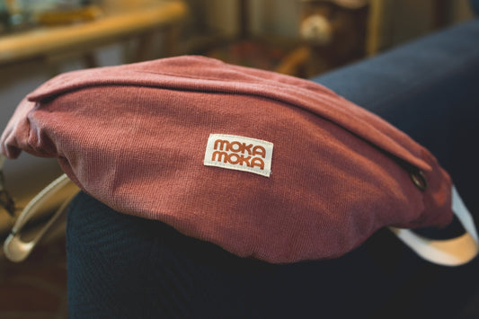 a red hat sitting on top of a blue couch