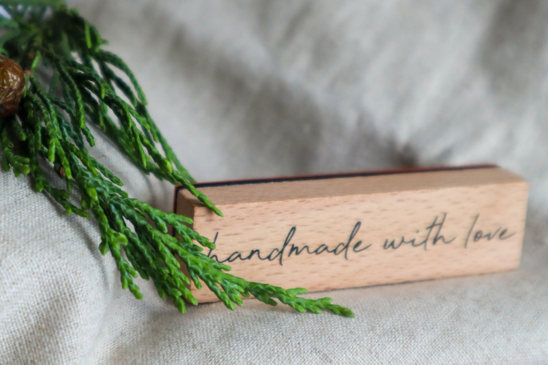 A piece of wood with writing on it