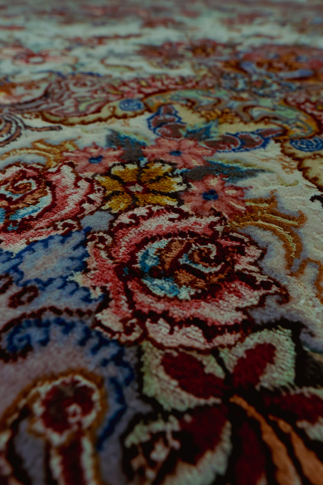 Detailed, floral pattern on a carpet.