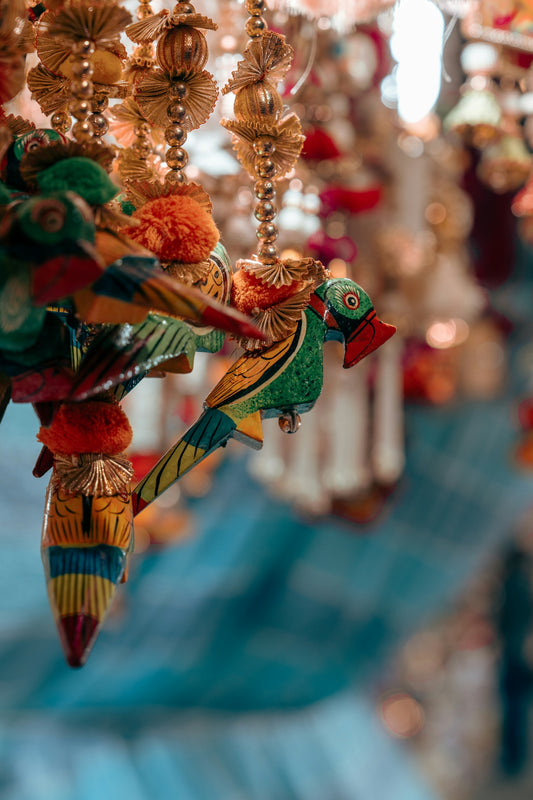 Colorful wooden parrot ornaments hanging together