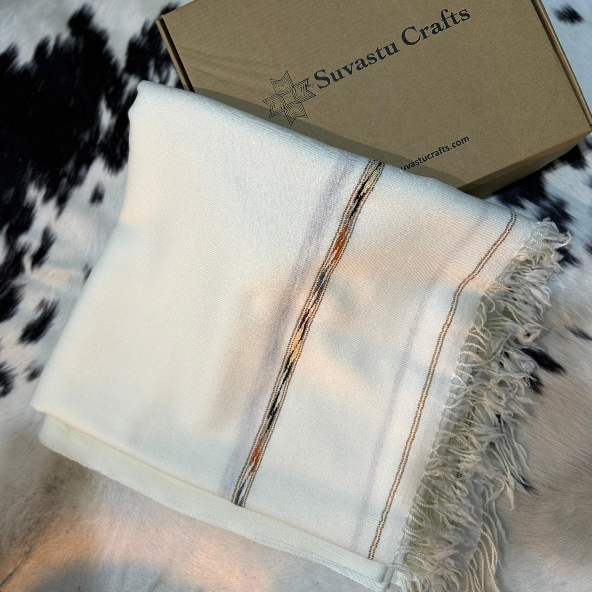 Elevate your style with the Swati 72 Wool Shawl, crafted from 100% pure wool for unbeatable warmth and comfort. Weighing 370 grams, this shawl is both lightweight and luxurious, offering an ideal balance of softness and durability. Designed for men who appreciate quality and elegance, its timeless style seamlessly complements any wardrobe, whether for everyday wear or special occasions. The natural wool fabric provides excellent insulation, keeping you warm in cooler weather, while its breathable nature ens